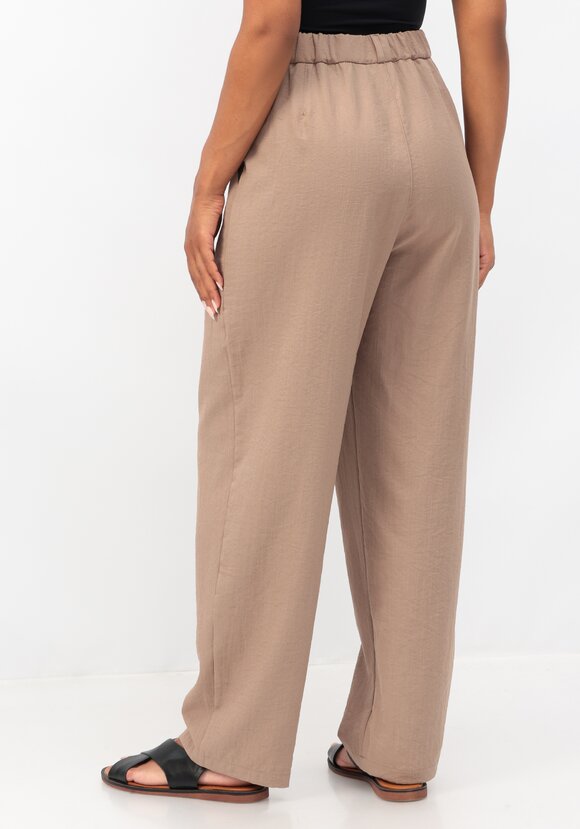 Брюки свободного кроя с защипами на поясе шир.  580, рис. 11