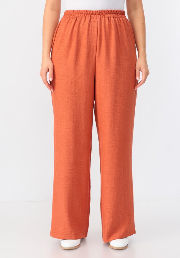 Брюки свободного кроя на резинке по поясу шир.  580, рис. 27