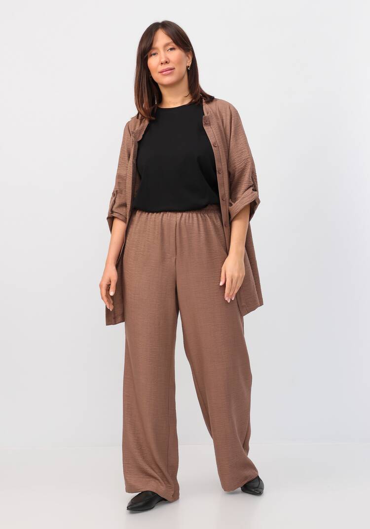 Брюки свободного кроя на резинке по поясу шир.  750, рис. 9