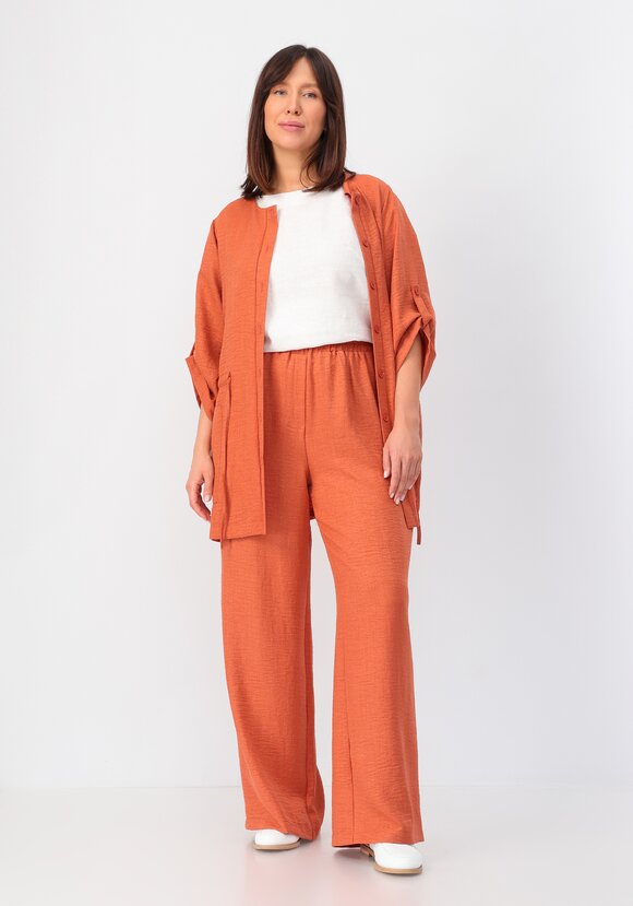 Брюки свободного кроя на резинке по поясу шир.  580, рис. 31