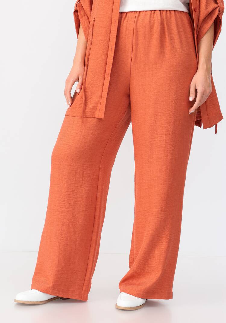 Брюки свободного кроя на резинке по поясу шир.  750, рис. 24