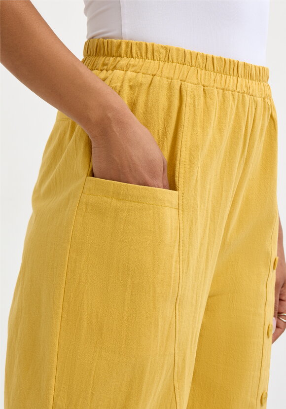 Брюки с декоративной планкой и карманами шир.  580, рис. 38