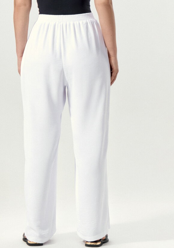 Брюки свободные на резинке по поясу шир.  580, рис. 10