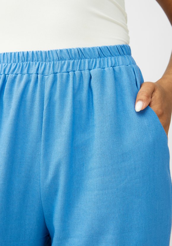 Брюки с декоративной складкой впереди шир.  580, рис. 16