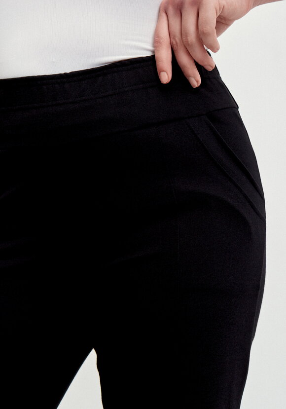 Брюки с эффектом утяжки и декором по низу шир.  580, рис. 5