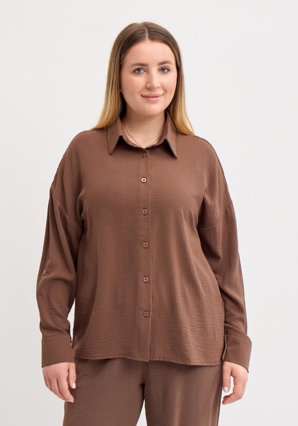 Рубашка свободного кроя с ассиметричным низом шир.  580, рис. 34