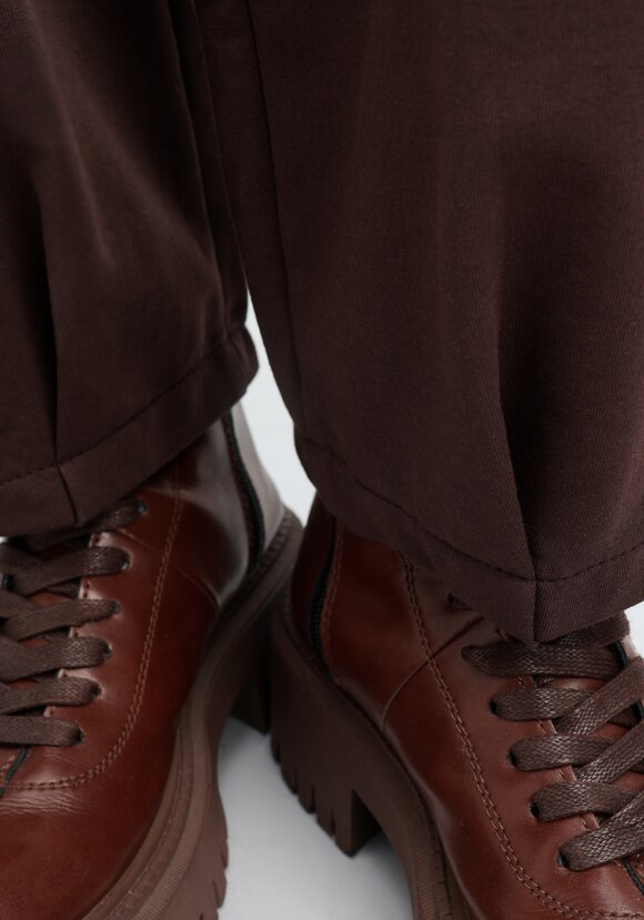 Брюки трикотажные с защипами по низу шир.  580, рис. 22