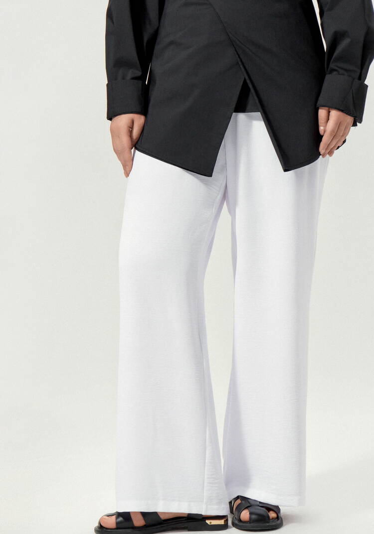 Брюки свободные на резинке по поясу шир.  750, рис. 9