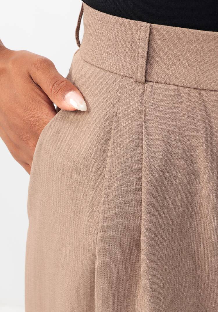 Брюки свободного кроя с защипами на поясе шир.  750, рис. 13