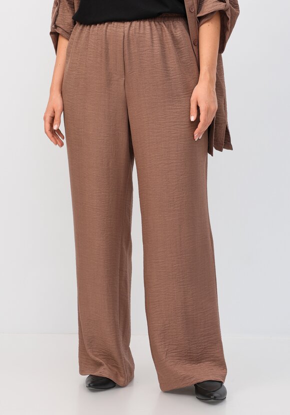 Брюки свободного кроя на резинке по поясу шир.  580, рис. 1