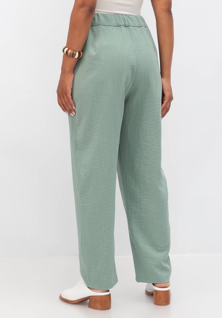 Брюки свободного кроя с защипами на поясе шир.  750, рис. 19